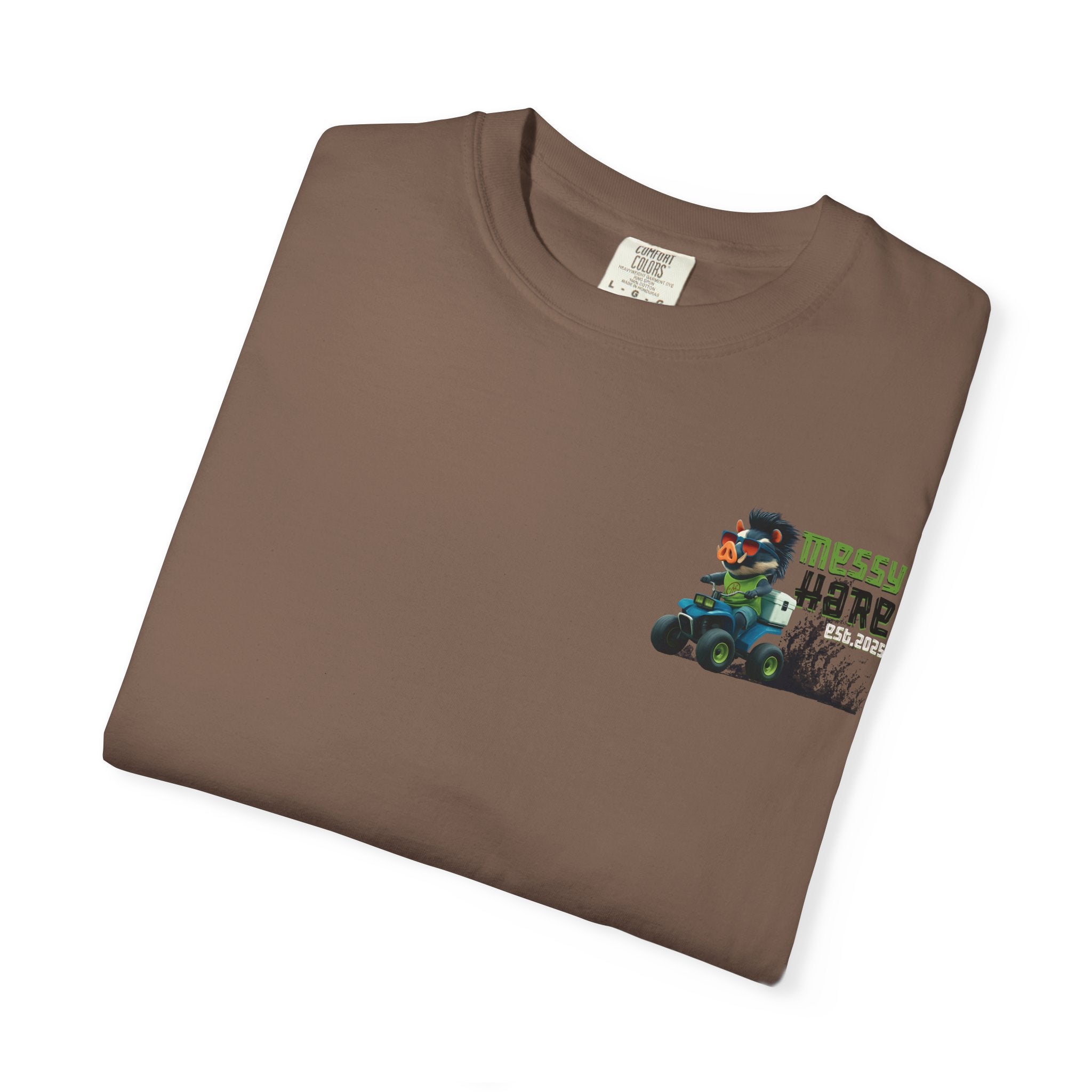 Folded brown t-shirt with a graphic of a character in a vehicle on a white background