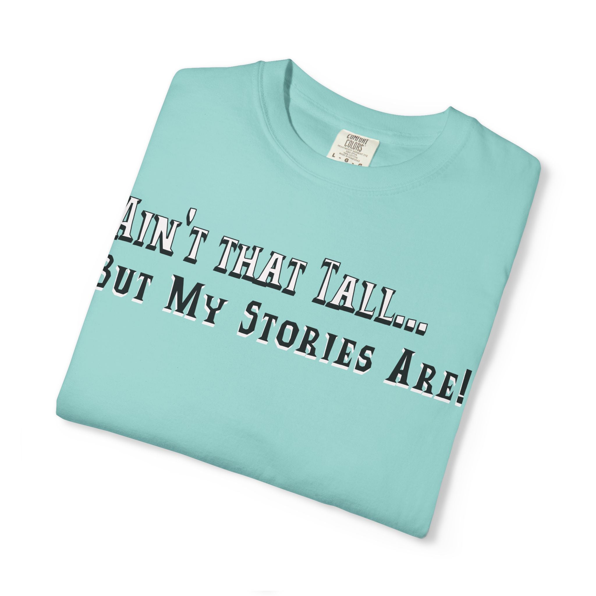 Folded light blue t-shirt with text on a white background