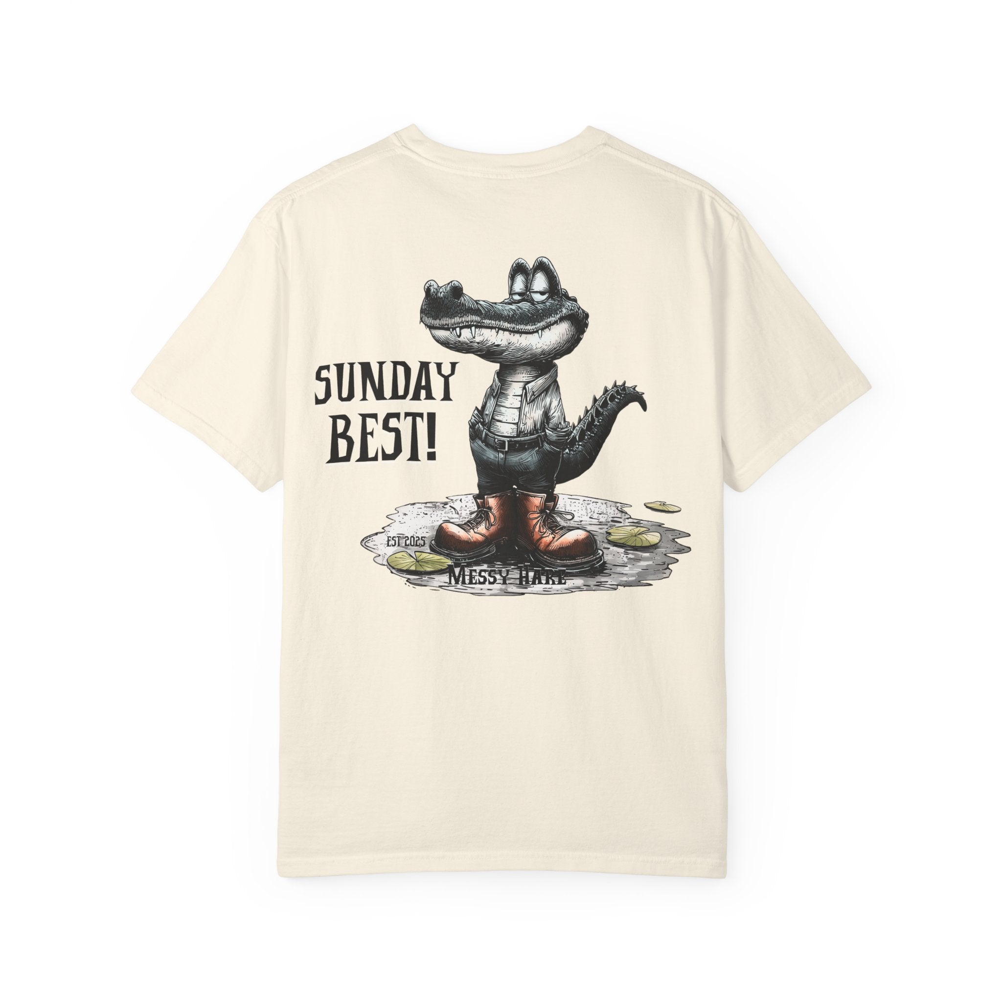 Beige t-shirt with a cartoon alligator wearing boots and 'SUNDAY BEST!' text on a white background