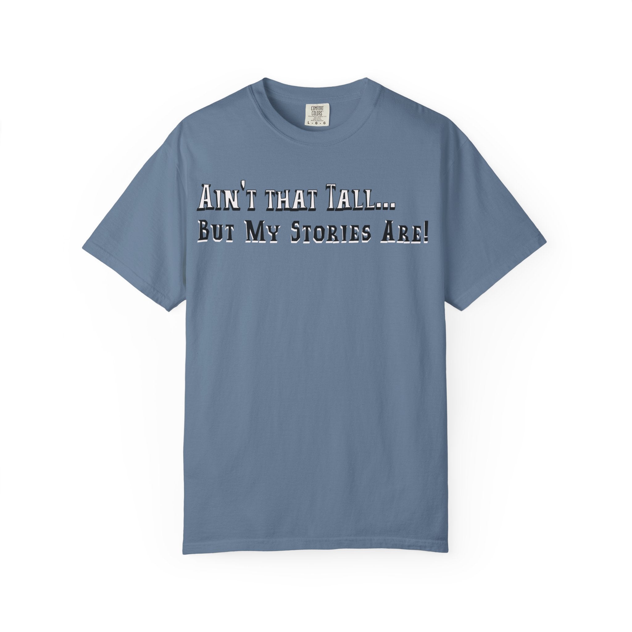 Blue t-shirt with text 'Ain't that tall... But my stories are!' on a white background
