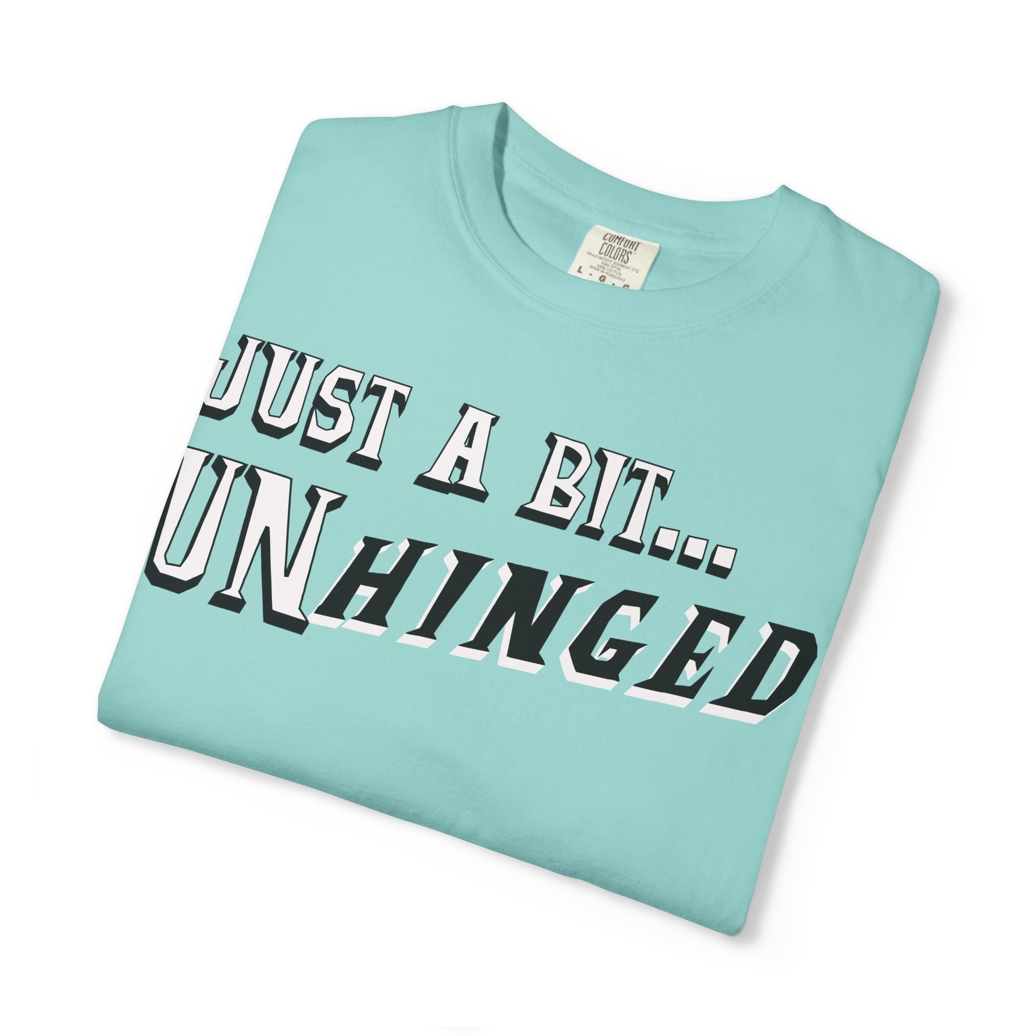 Light blue t-shirt with text 'JUST A BIT... UNHINGED' on a white background