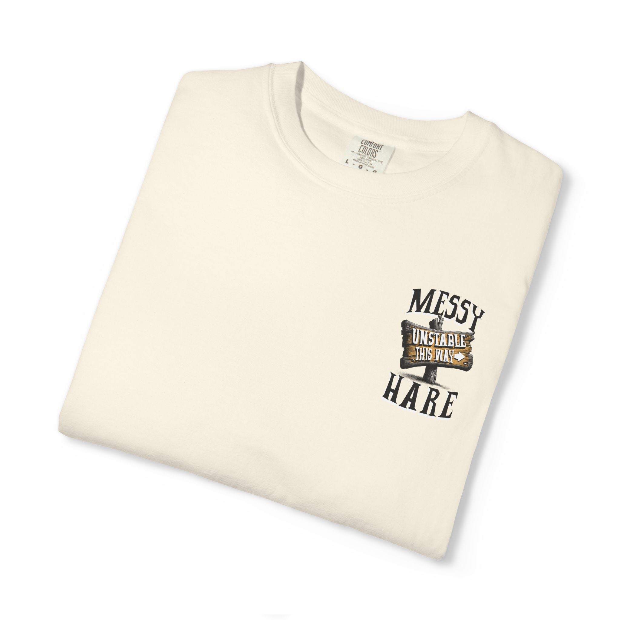Folded cream-colored t-shirt with graphic design and text on a white background
