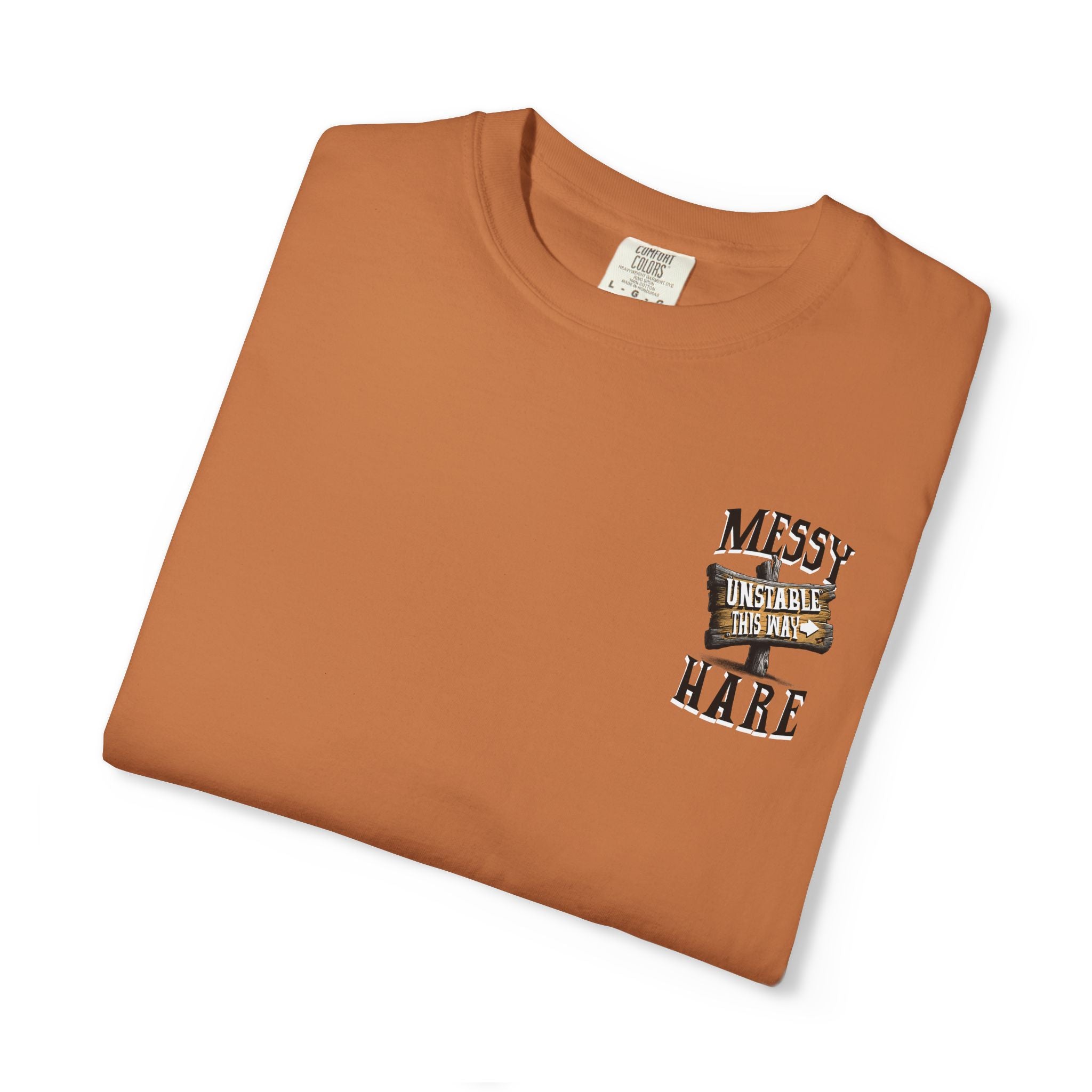 Folded brown t-shirt with graphic design on a white background