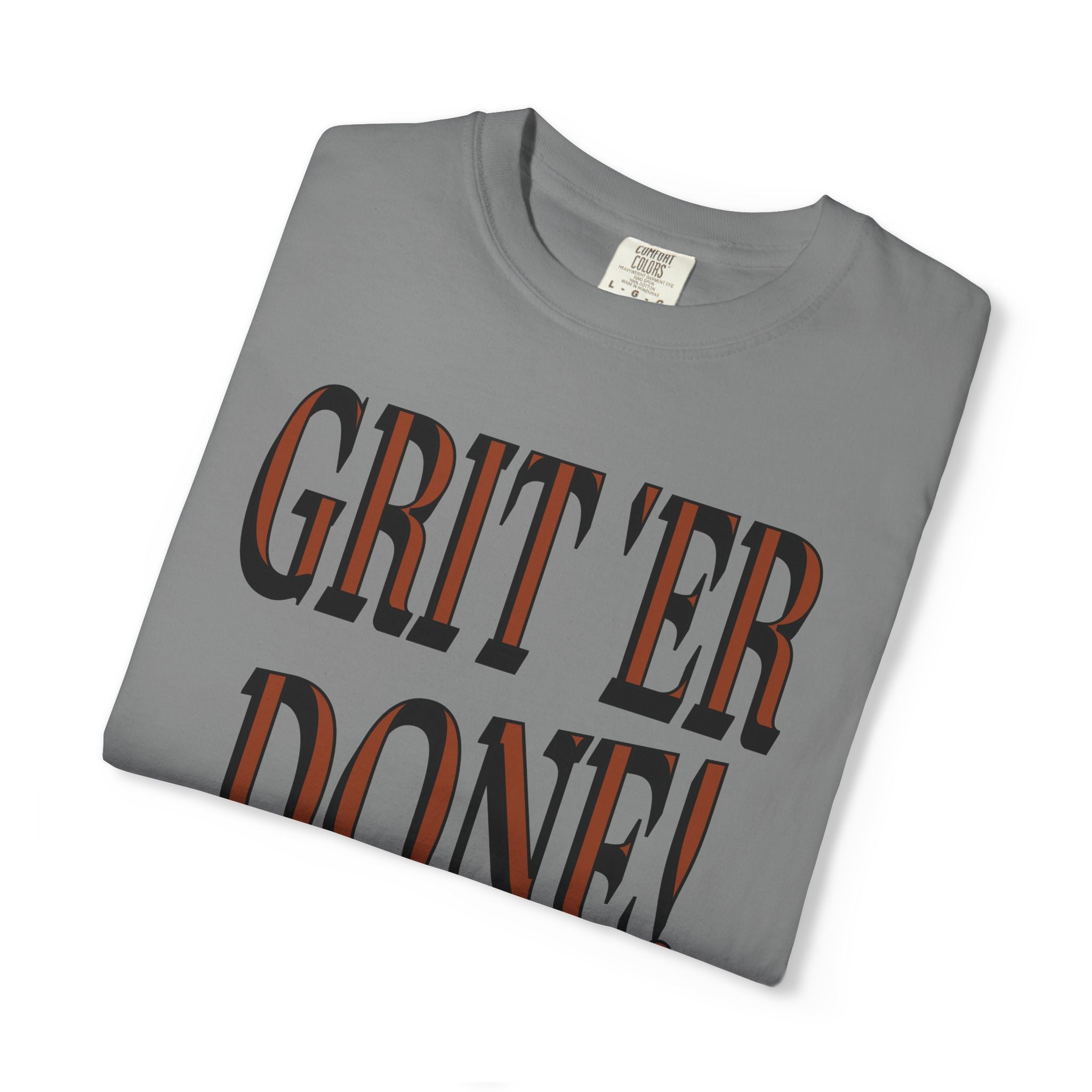 Folded gray t-shirt with 'GRIT'ER DONE!' text on a white background