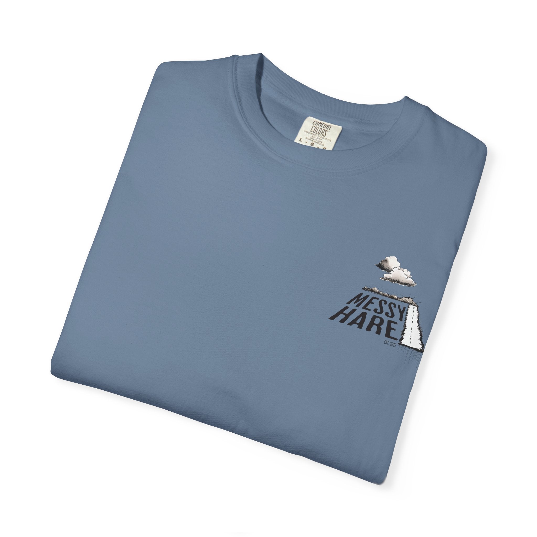 Folded blue t-shirt with 'Messy Hare' logo on a white background