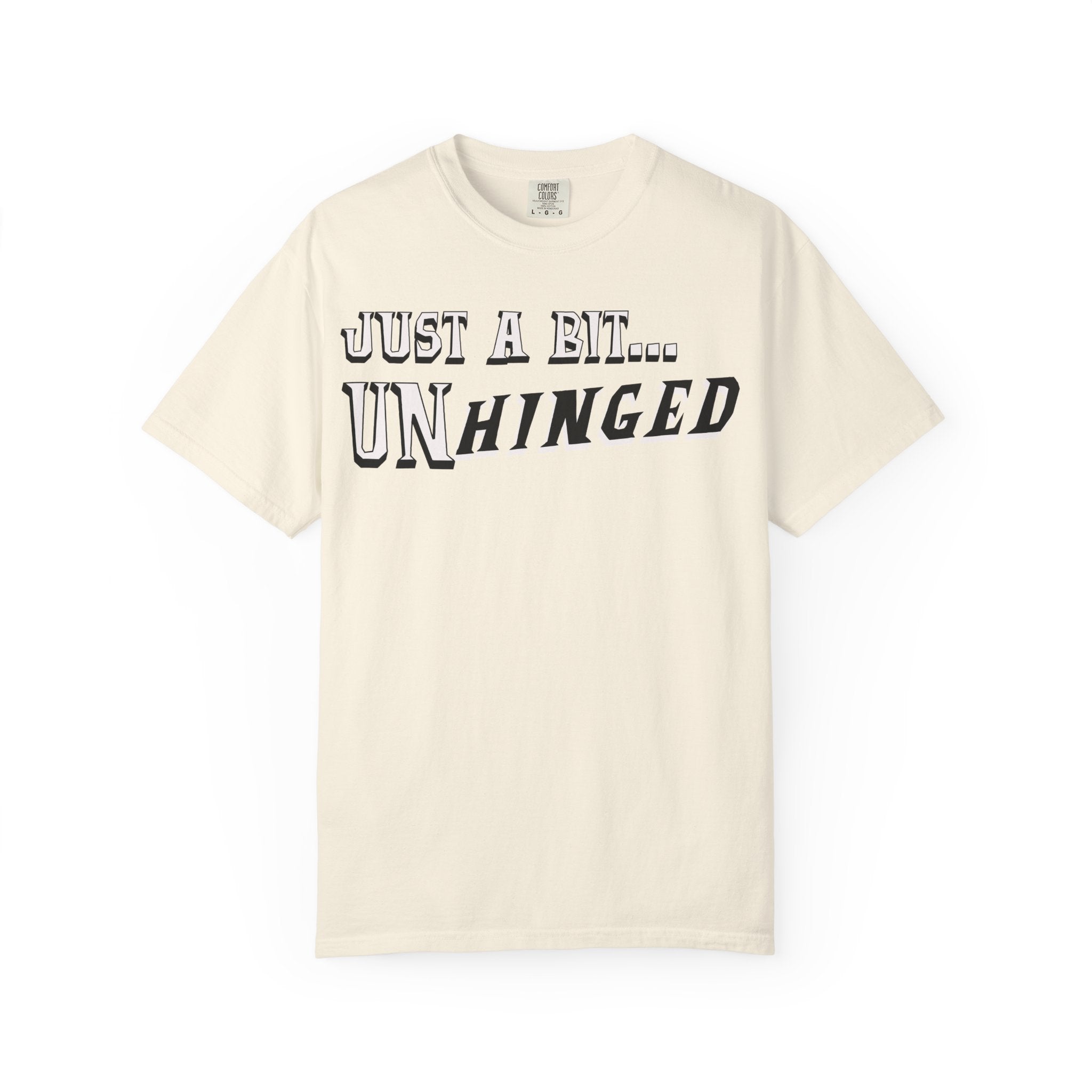 Beige t-shirt with 'Just a Bit... Unhinged' text on a white background