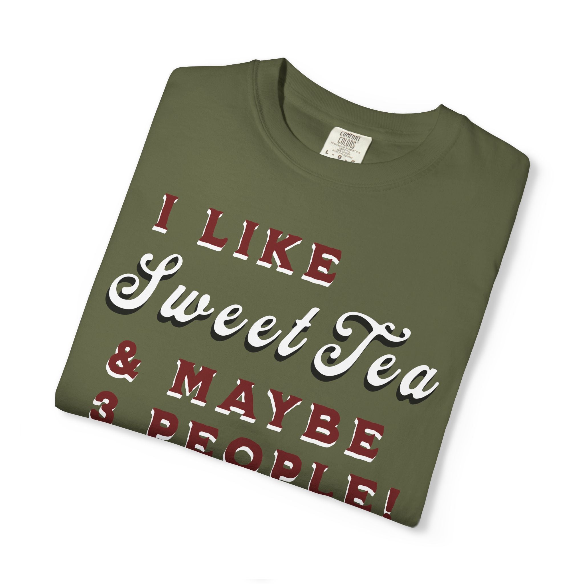 Folded green t-shirt with text 'I LIKE Sweet Tea & MAYBE PEOPLE!' on a white background