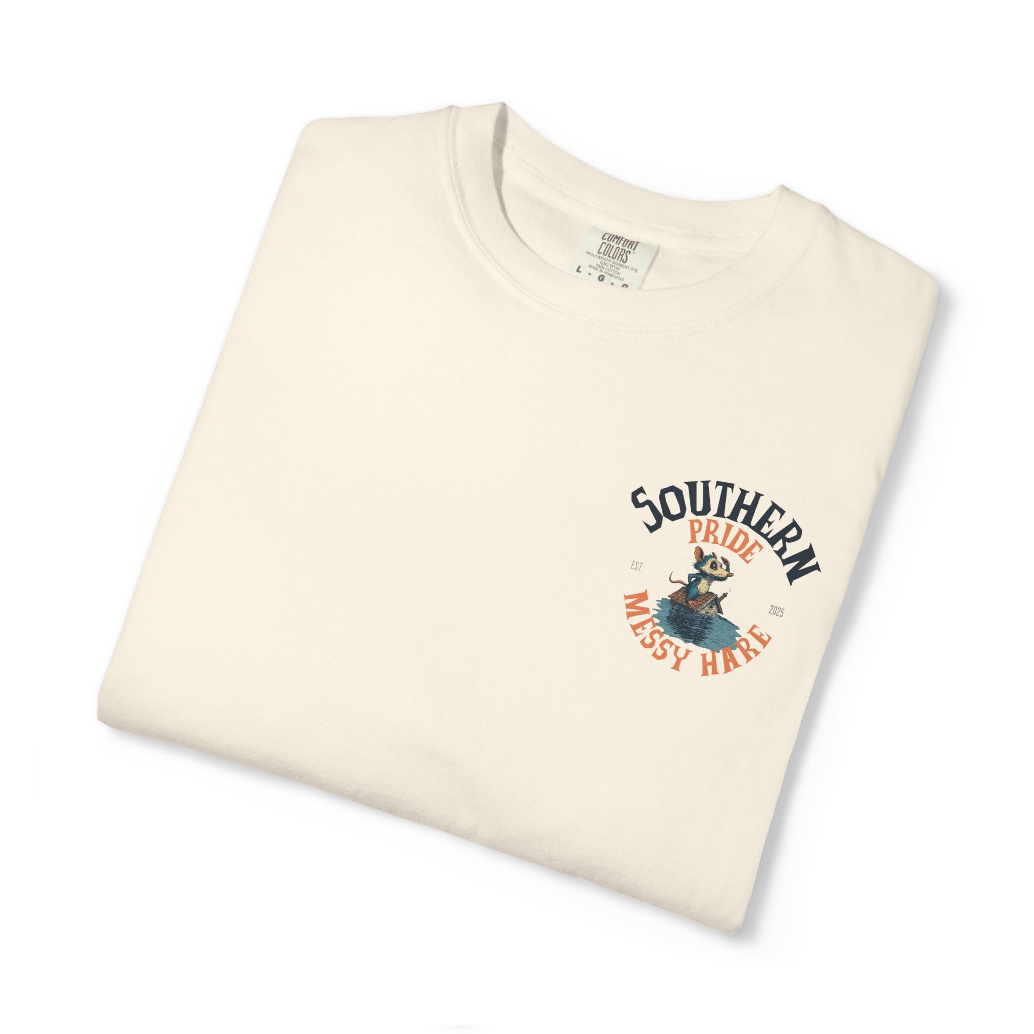 Folded cream-colored t-shirt with 'Southern Pride Messy Hair' graphic on a white background
