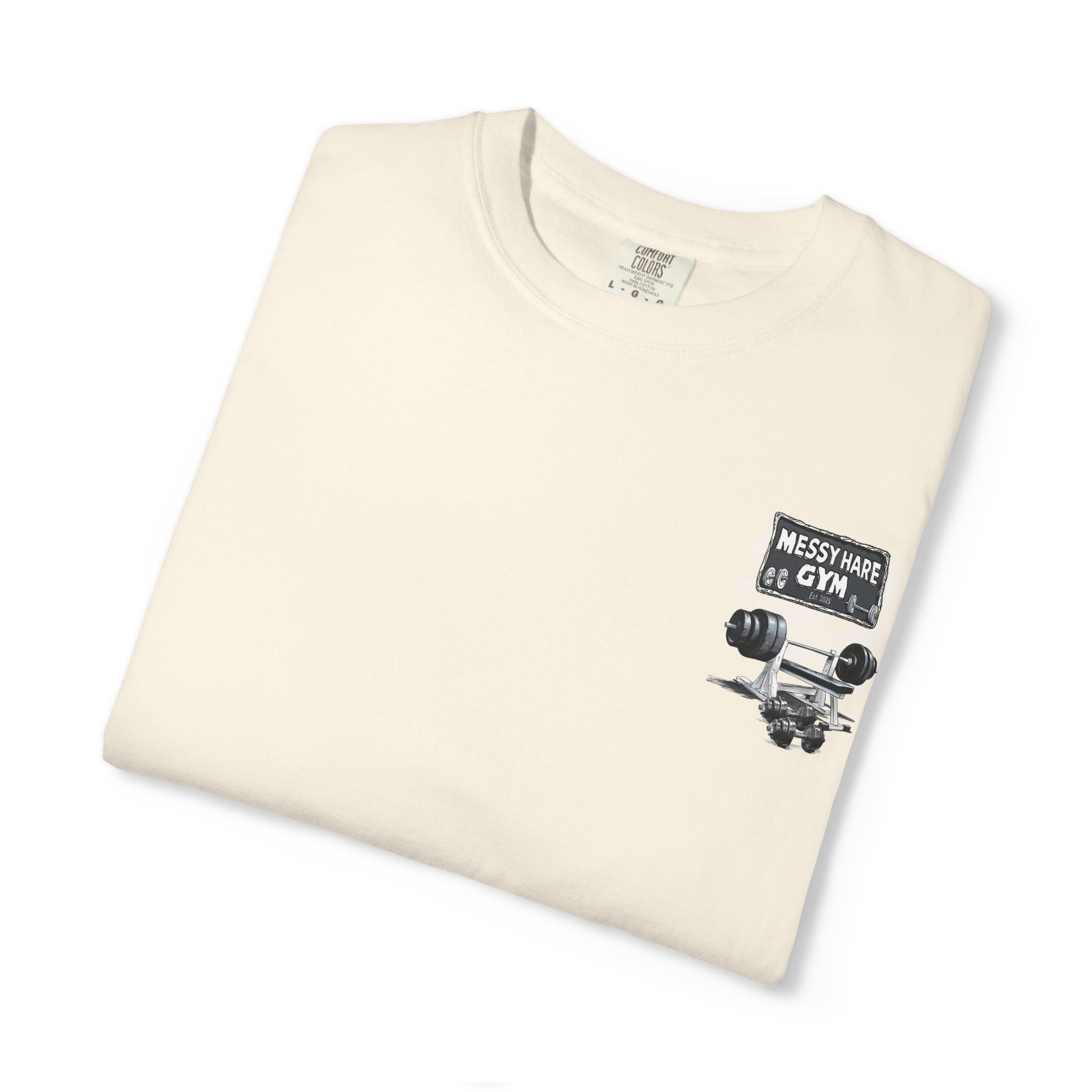 Folded cream t-shirt with 'Messy Hare Gym' graphic on a white background