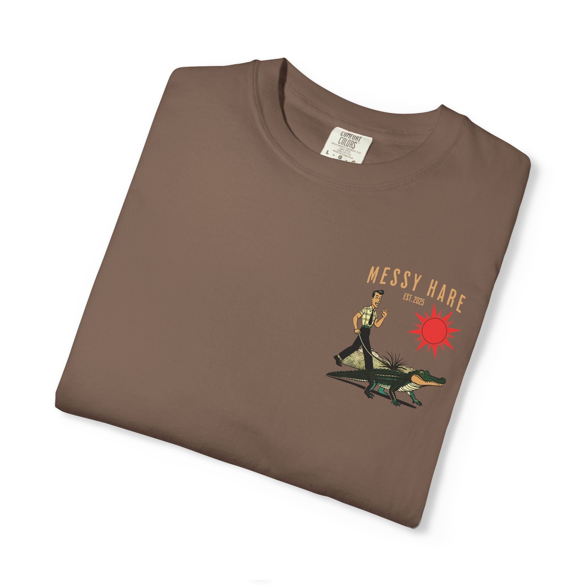 Folded brown t-shirt with 'Messy Hare' graphic design on a white background