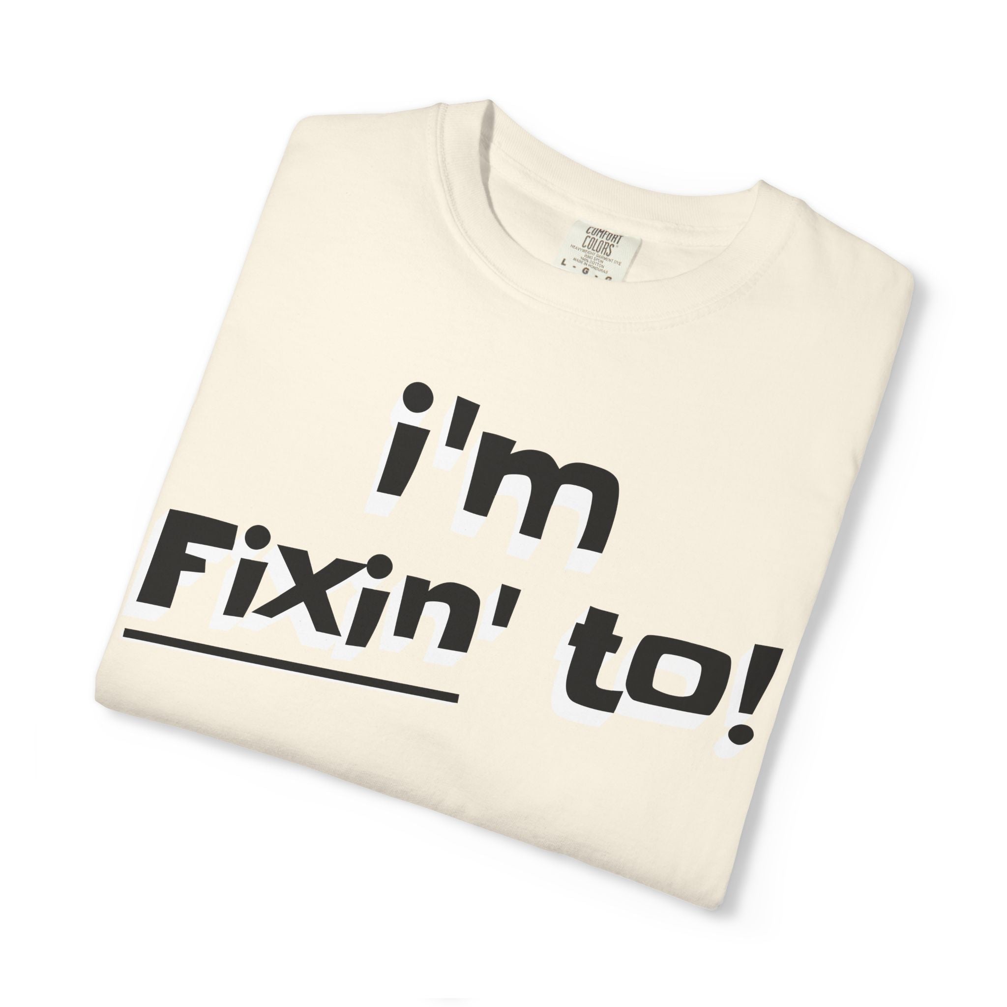 Folded t-shirt with 'i'm Fixin' to!' text on a white background