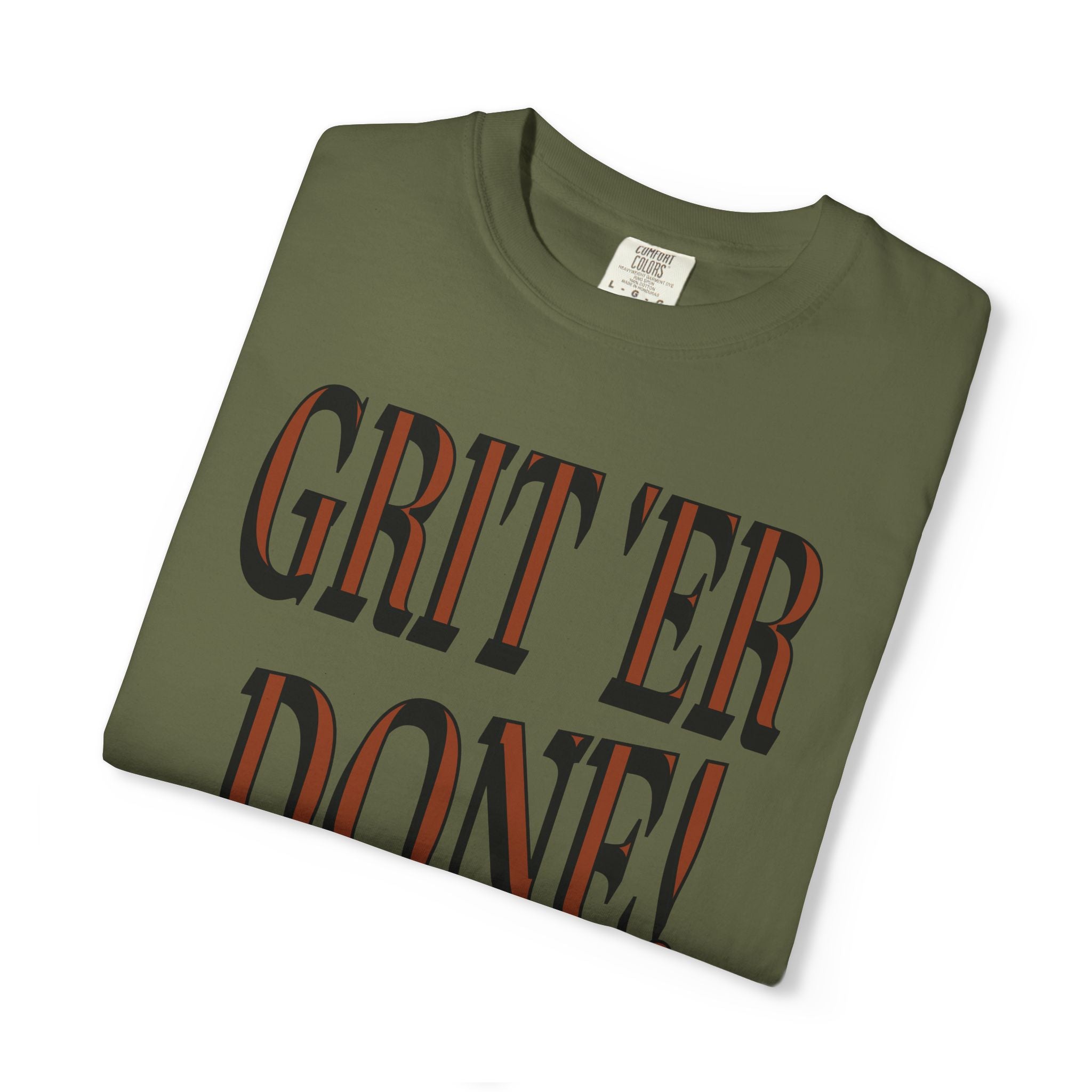 Folded green t-shirt with 'GRIT'ER DONE!' text on a white background