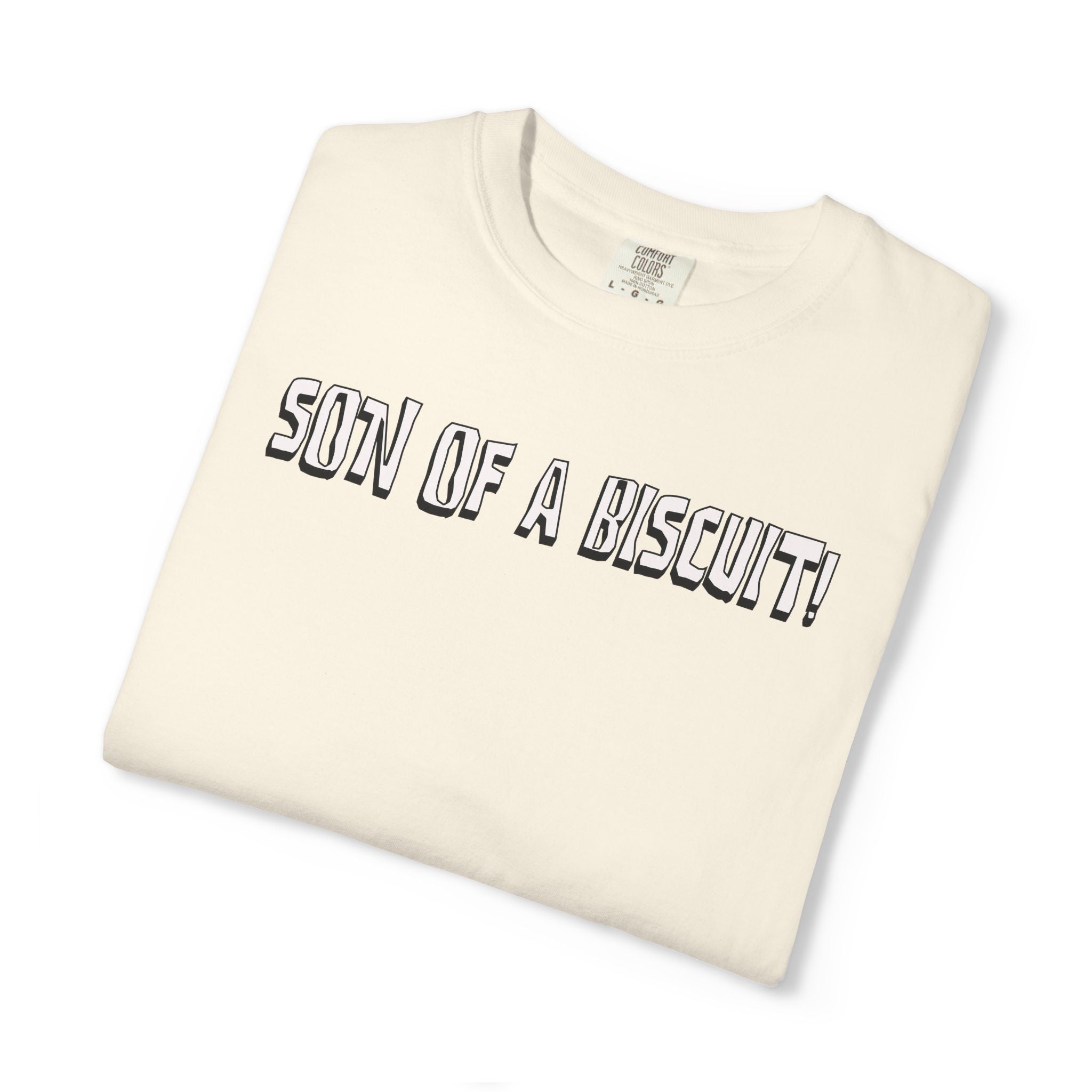 Folded cream-colored t-shirt with 'Son of a Biscuit!' text on a white background