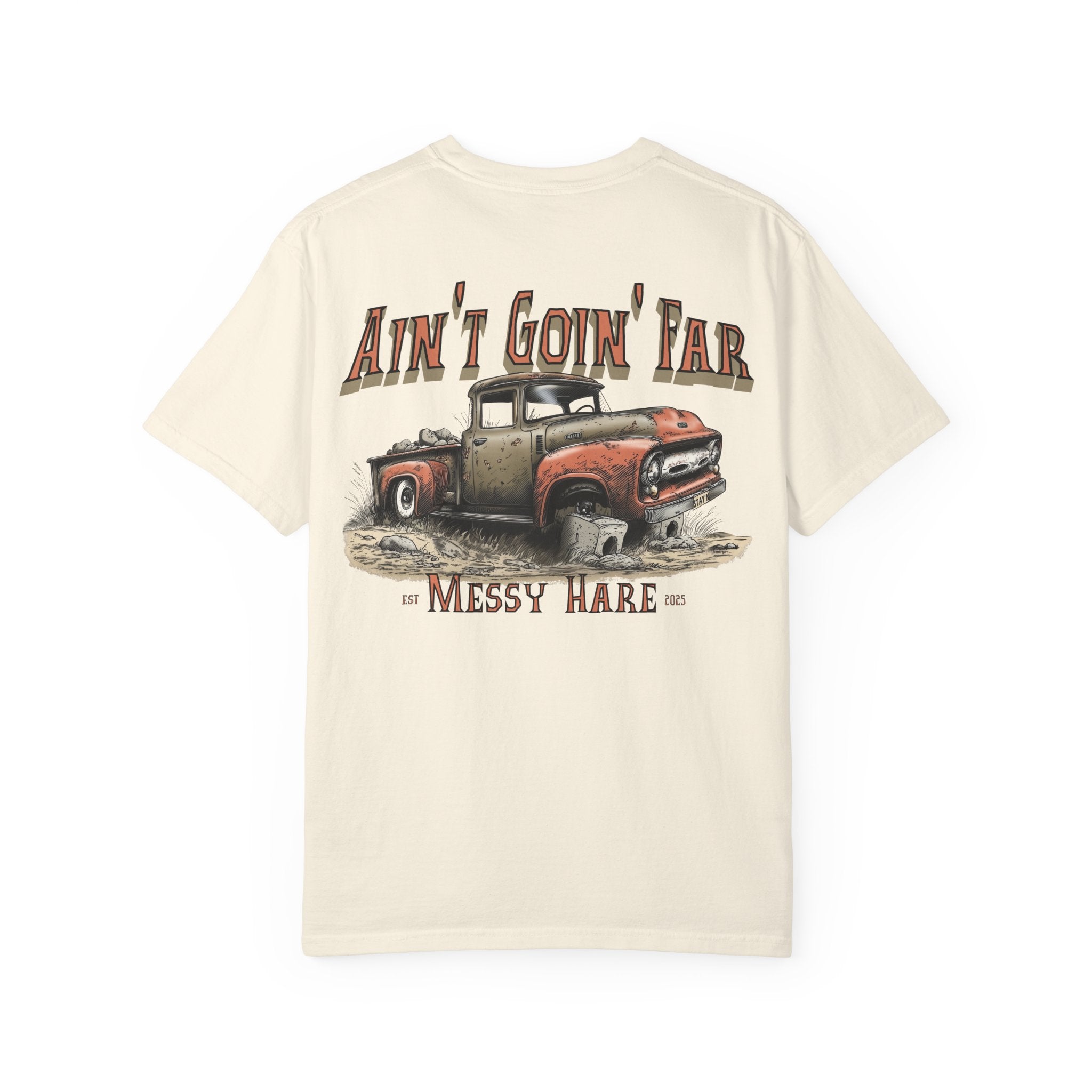 Beige t-shirt with a graphic of an old truck and text 'Ain't Goin' Far Messy Hare' on a white background