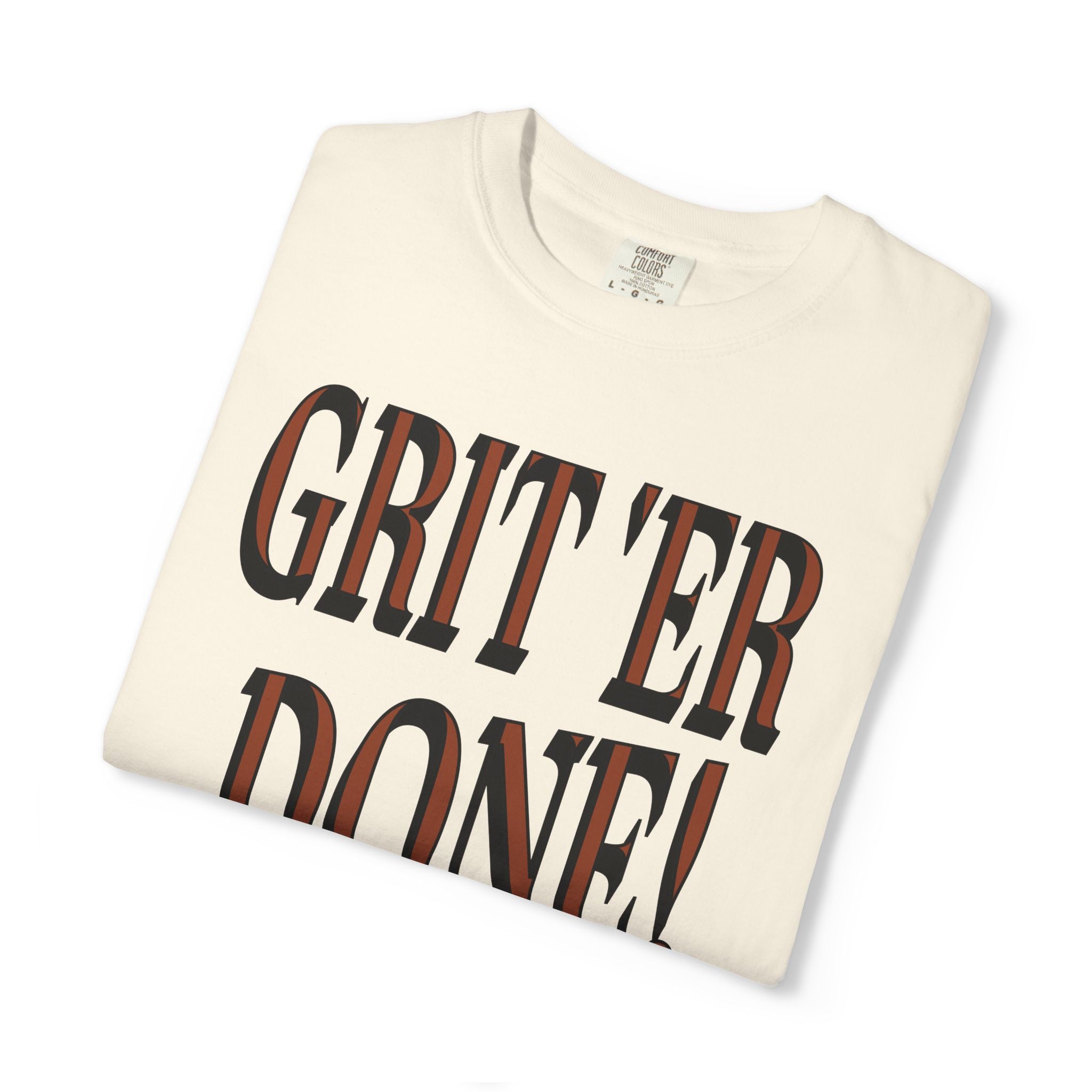 Folded t-shirt with 'GRIT'ER DONE!' text on a white background