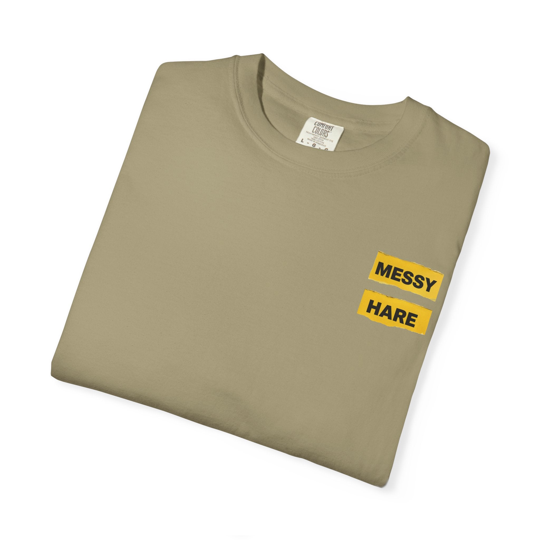 Folded khaki t-shirt with 'Messy Hare' text on a white background