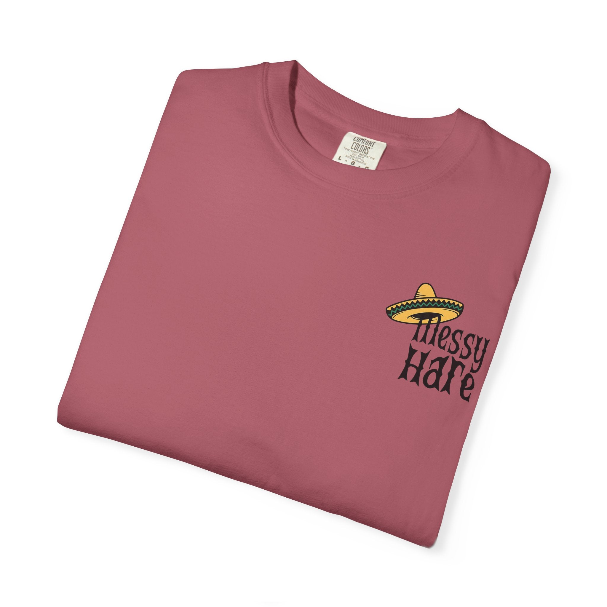 Folded maroon t-shirt with 'Messy Hare' text and logo on a white background