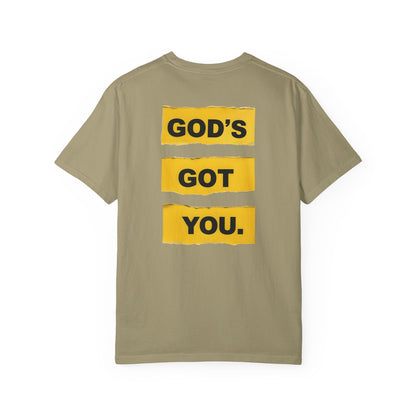 Khaki t-shirt with 'GOD'S GOT YOU.' text on a white background