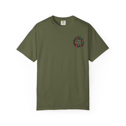 Green t-shirt with a small graphic on the chest against a white background