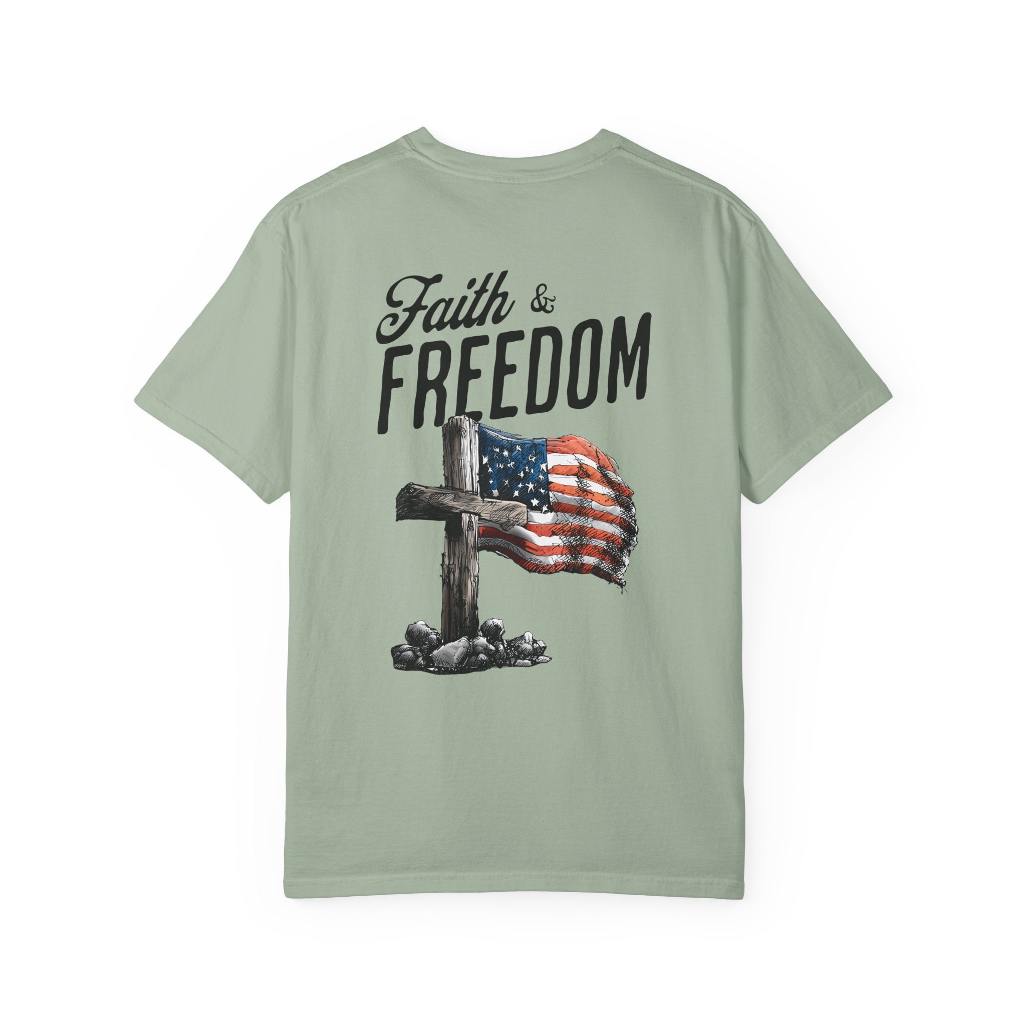 Light green t-shirt with 'Faith & Freedom' text and cross with American flag design on a white background