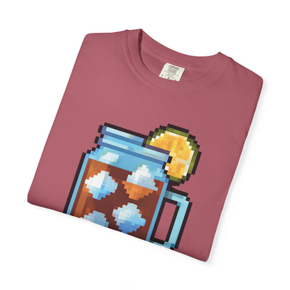Folded maroon t-shirt with pixel art design of a jar and lemon on a white background
