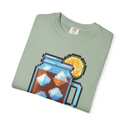 Folded green t-shirt with pixel art design on a white background