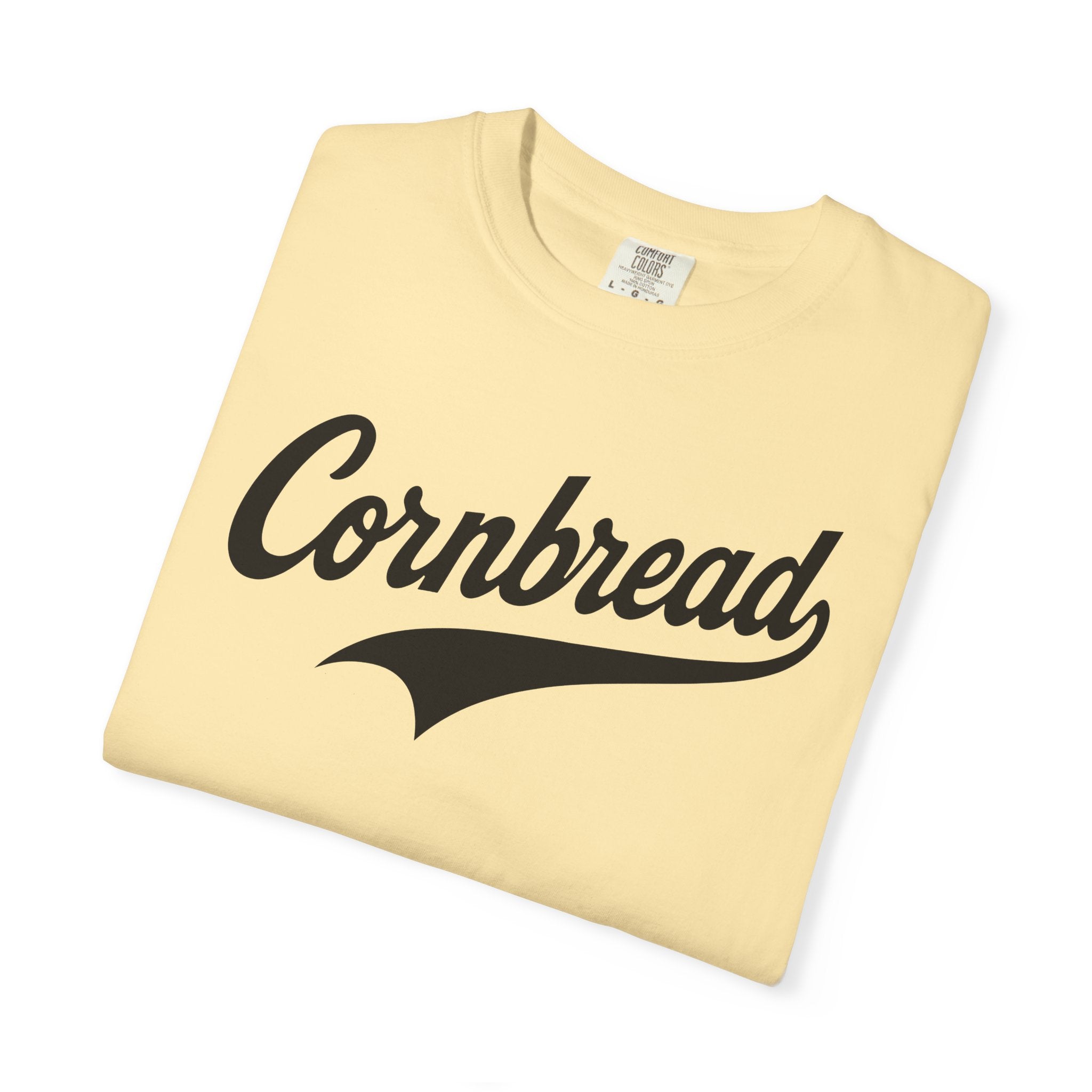 Folded beige t-shirt with 'Cornbread' text on a white background