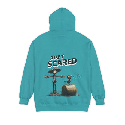 Teal hoodie with scarecrow graphic and 'Ain't Scared' text on a white background