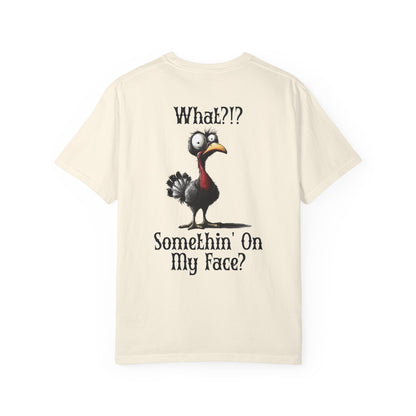 Beige t-shirt with cartoon chicken graphic and text on a white background
