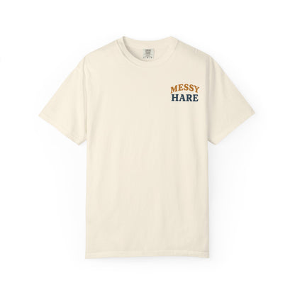Beige t-shirt with 'Messy Hare' text on a white background