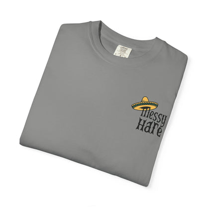 Folded gray t-shirt with 'Messy Hare' logo on a white background