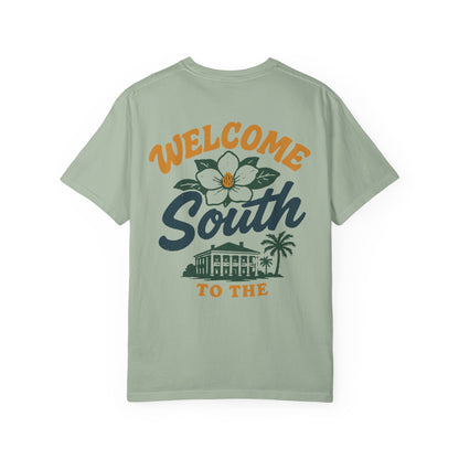 Light green t-shirt with 'Welcome South' graphic on a white background