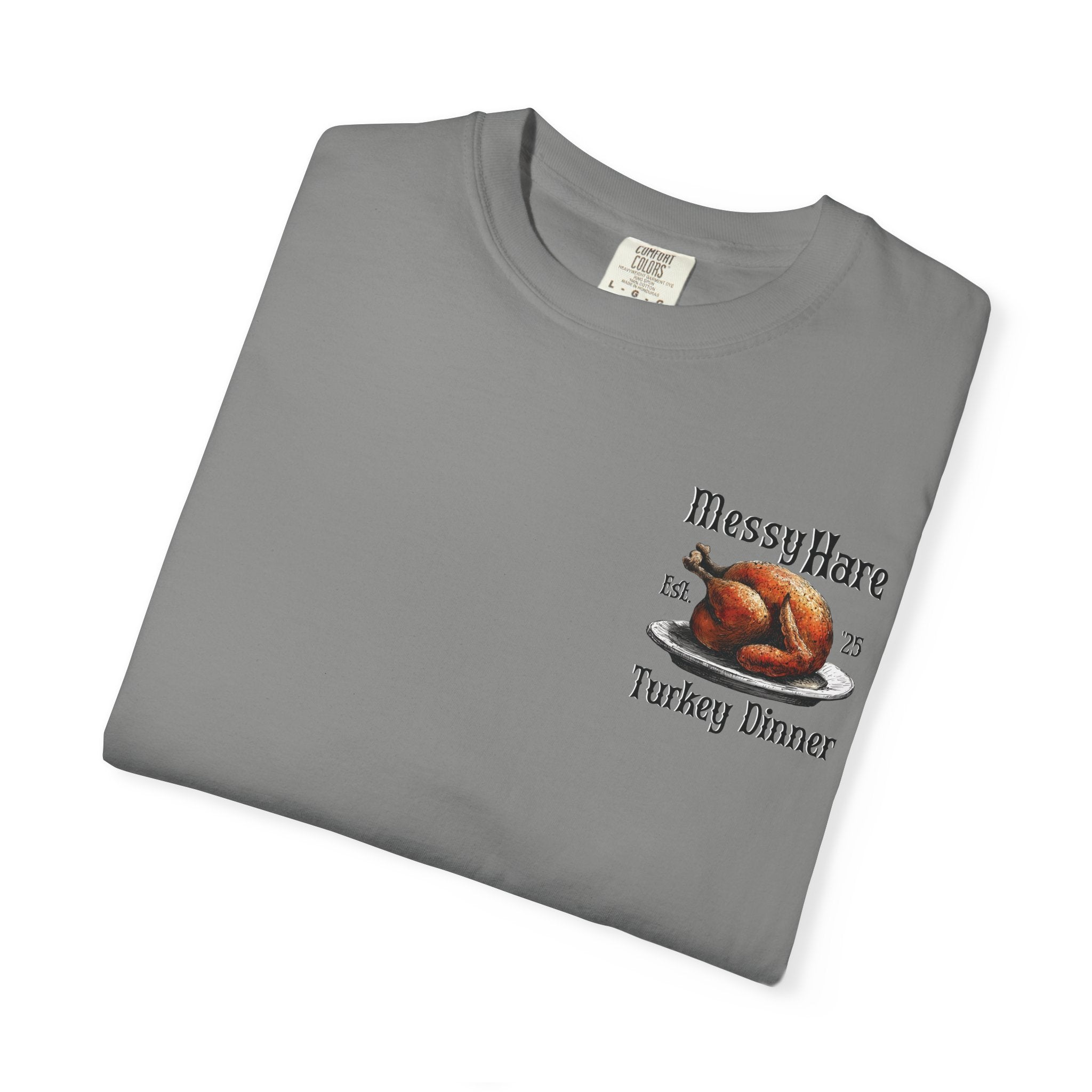 Folded gray t-shirt with 'MessyHare' and 'Turkey Dinner' graphic on a white background
